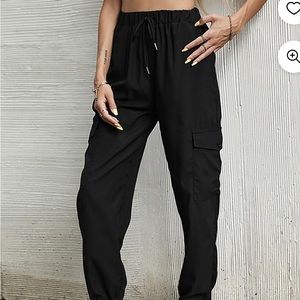 NWT ladies black cargo athletic pants with drawstring waist.